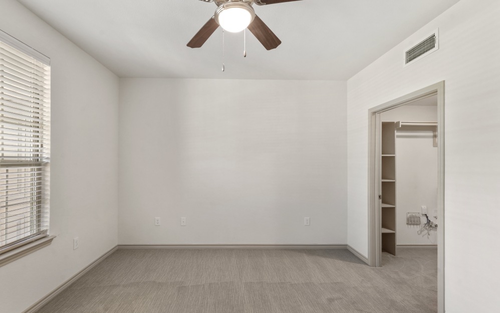 Bedroom with natural lighting and high ceilings