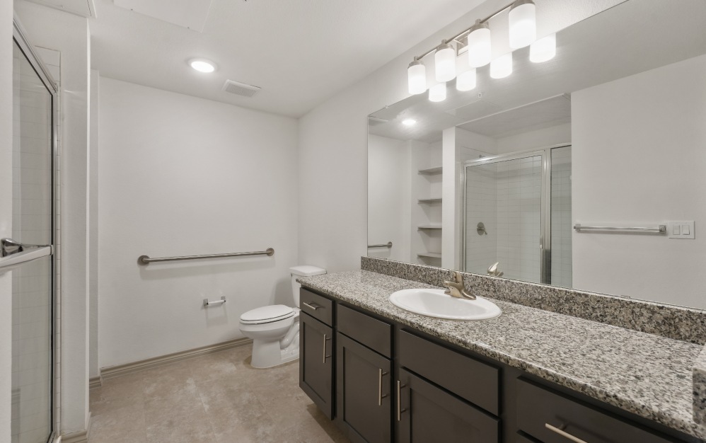 Spacious bathroom with ample lighting