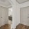 hallway view of bathroom next to apartment entrance