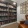 shelves of books and reading chair in library