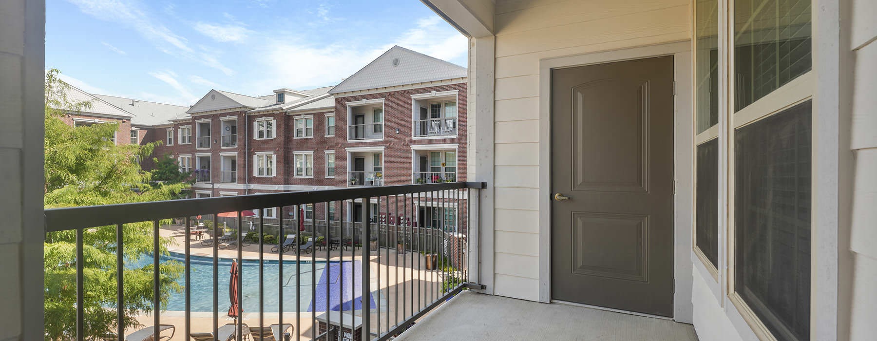 private balcony overlooking pool area